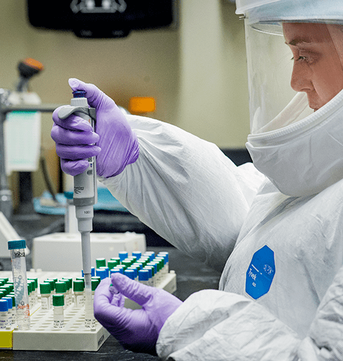 a Tulane TNPRC scientist runs a test on samples