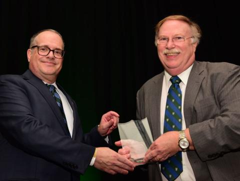 Robert Garry receives award from David Banush
